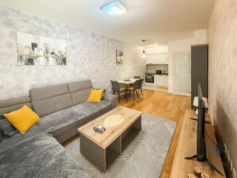 Living room connected to the dining area and kitchen in an open space layout. - image 4