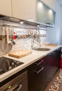 View of a modern equipped kitchen with work surfaces and built-in elements. - image 5