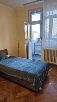 Bedroom with a bed and access to the balcony. - image 7