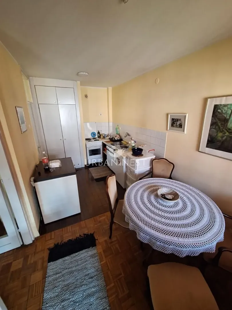 Smaller kitchen with a dining table and chairs.