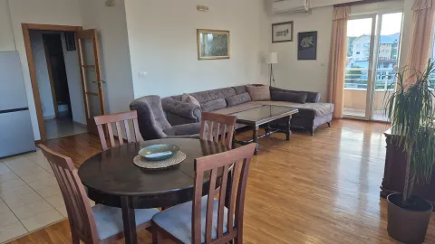 Living room with a dining table and a seating set. - image 3