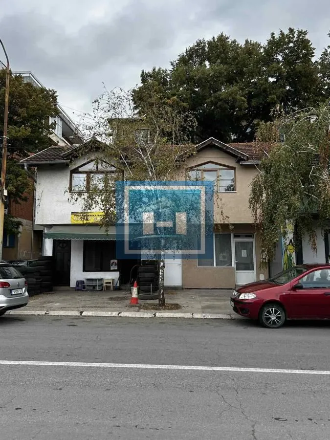 View of the building exterior from the street and parking area.