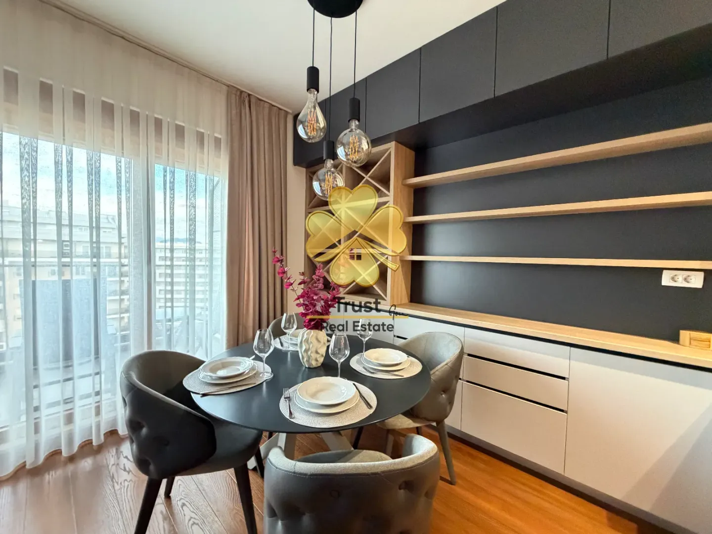 Modern dining area with a round table and built-in cabinetry.