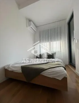 Bedroom with a double bed and air conditioning. - image 9