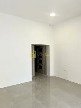 Empty room with white walls and a door. - image 5