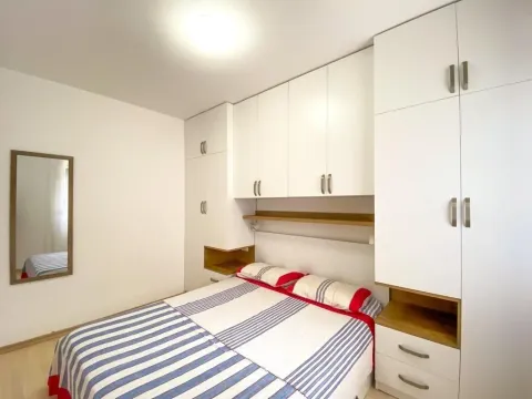 Bedroom with a double bed and fitted wardrobes. - image 16