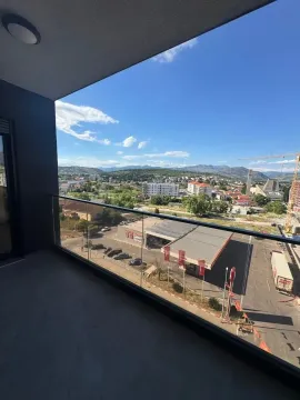View from the balcony overlooking the city and surroundings. - image 9