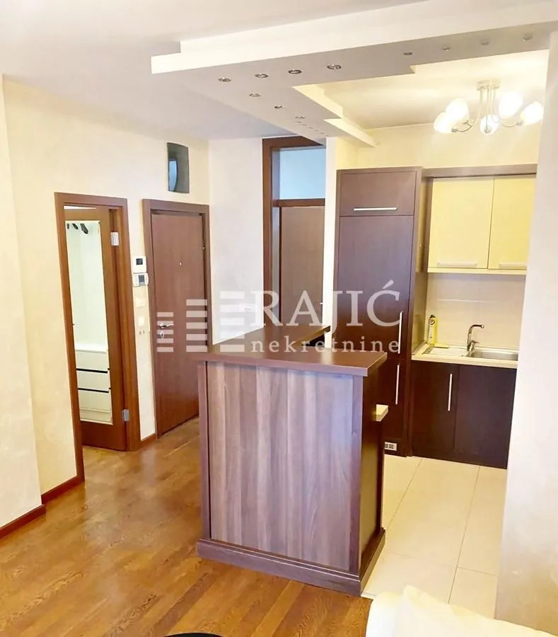 Small kitchen connected to the hallway and living room.