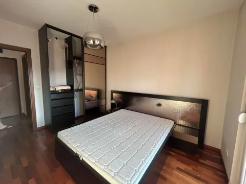 Furnished bedroom with a double bed and a fitted wardrobe. - image 4