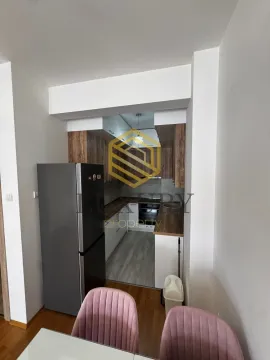 View of a modern equipped kitchen with dining area. - image 9