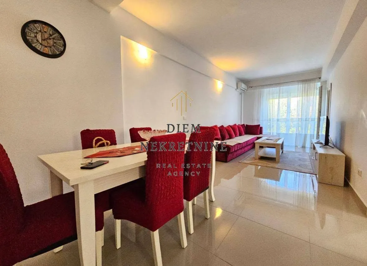 Spacious living room with a dining area and seating set.