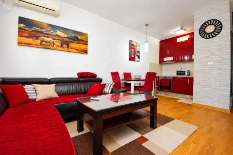 Living room connected to the dining area and kitchen in a modern apartment. - image 3