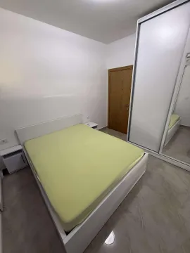 Bright bedroom with a double bed and a large mirrored wardrobe. - image 5