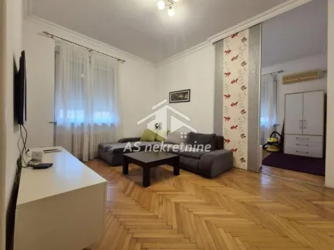 Living room with a sofa set and parquet flooring. - image 3