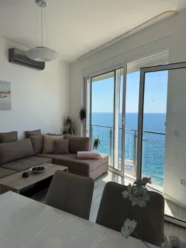 Living room with a sofa and a sea view. - image 5