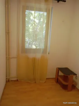 Small room with a window and a small side table. - image 9