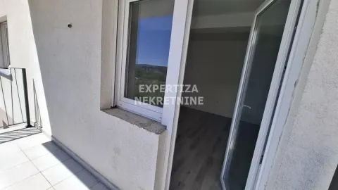 View from the terrace through open balcony doors towards the interior of the room. - image 6
