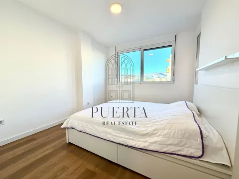 Bright bedroom with a double bed and a window view. - image 10