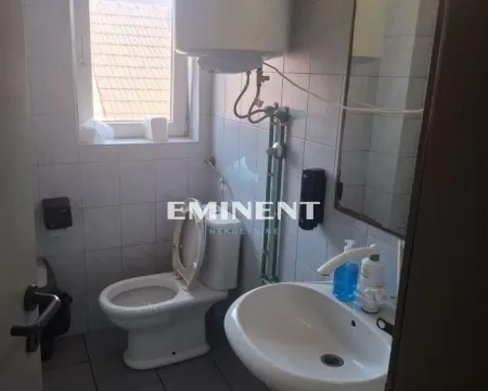 View of the bathroom with a sink and toilet. - image 12