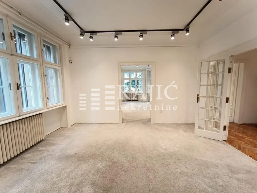 Empty bright room with carpet and white walls.