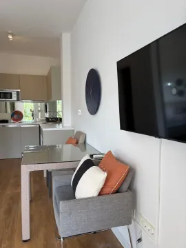 Living room with dining area and a view of the kitchen. - image 5