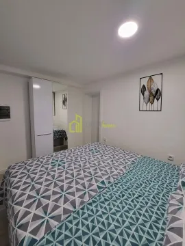 Furnished bedroom with a double bed and wardrobe. - image 7