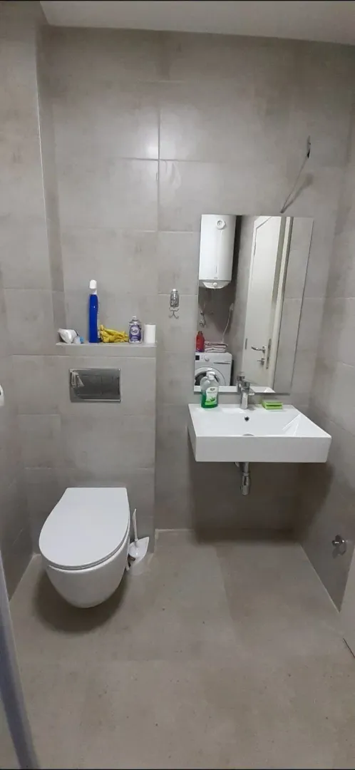 Simple bathroom with a toilet and a sink.