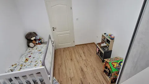 Children's bedroom with a bed and toys. - image 7
