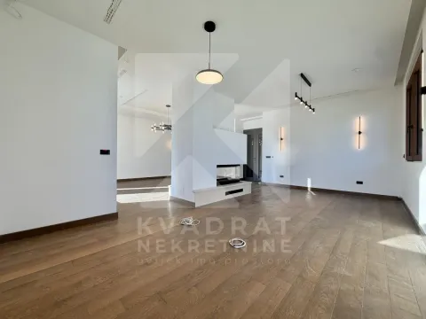 Spacious bright living room with parquet flooring and built-in lighting. - image 26