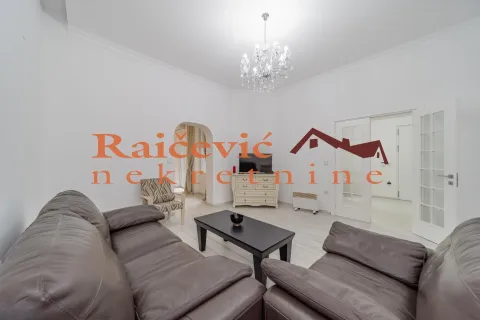 Living room with leather sofas, a coffee table, and a TV cabinet. - image 15