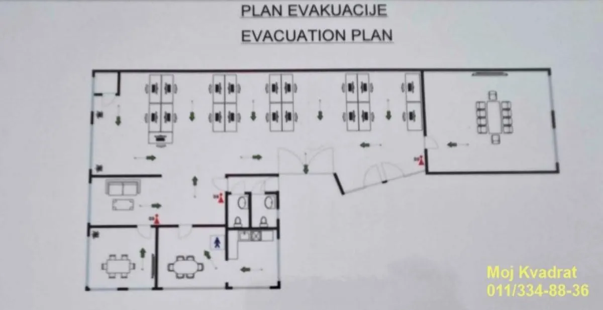 Evacuation plan of the office space showing the layout of rooms and exits.