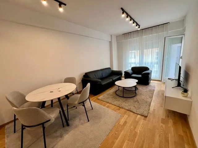 Living room with dining area and seating furniture.