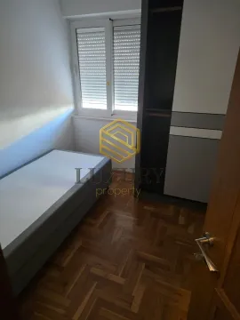 Smaller bedroom with a bed and a built-in wardrobe. - image 5