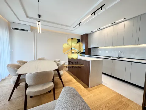 Modern kitchen with dining area and built-in units. - image 5