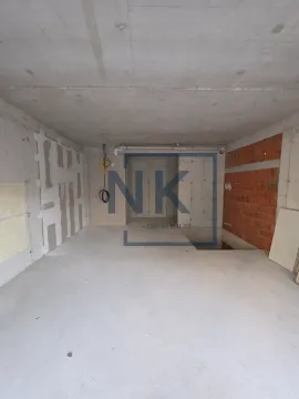 Unfinished space under construction with concrete floors and walls. - image 2