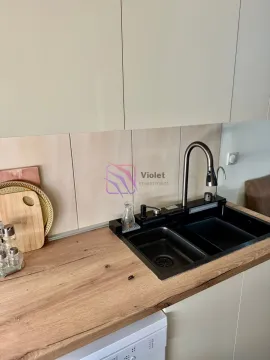 View of the kitchen sink and countertop. - image 5