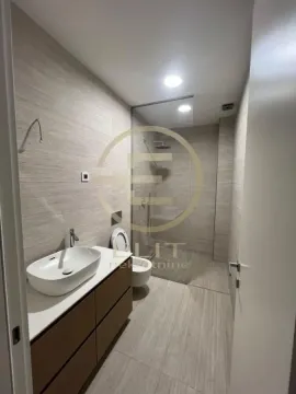 Modernly equipped bathroom with a washbasin, shower cabin and toilet. - image 9