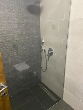 Modernly equipped bathroom with a walk-in shower. - image 2