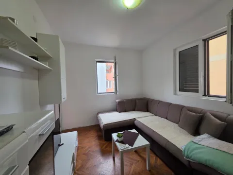 Living room with a sectional sofa, coffee table, and white furniture. - image 17