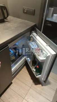 View of the built-in refrigerator in the kitchen. - image 6