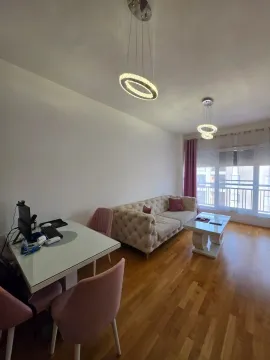 Living room with a sofa, dining table, and access to the terrace. - image 3