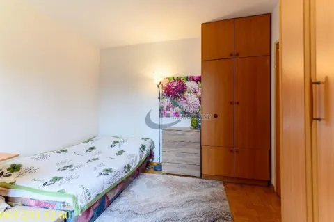 Furnished bedroom with a bed, wardrobe, and chest of drawers. - image 10
