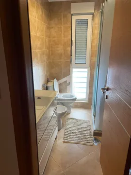 View of the bathroom with a washbasin, toilet, bidet, and shower cabin. - image 7