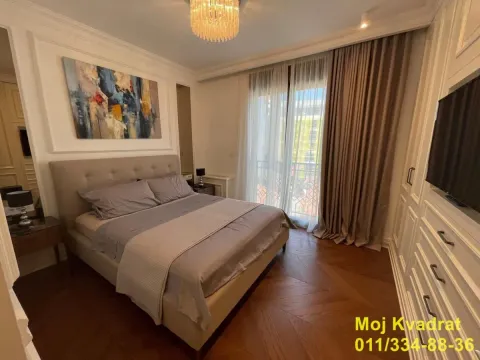 Modern bedroom with a double bed, wardrobe, and access to the terrace. - image 8