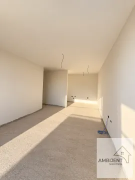 Empty room in rough construction phase with painted walls. - image 6