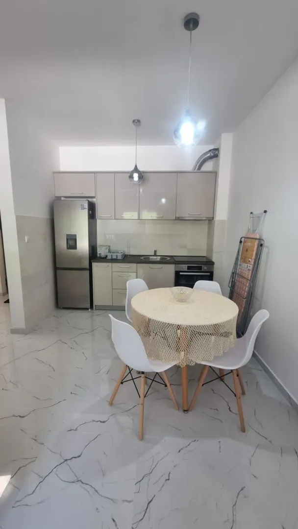 Kitchen with a dining table and chairs.