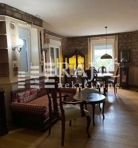 Living room with sofa set and dining area.