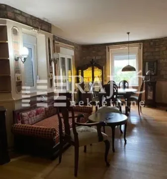 Living room with sofa set and dining area. - image 19