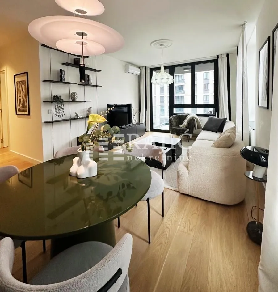 Modern living room with a dining area and seating set.