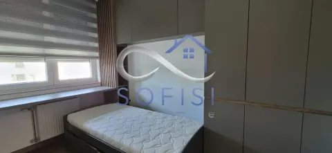 Small bedroom with a bed and fitted wardrobes. - image 11
